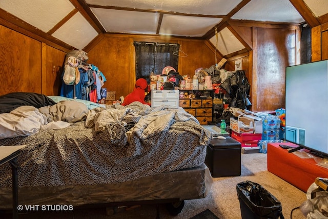 interior space with lofted ceiling, wooden walls, and carpet floors