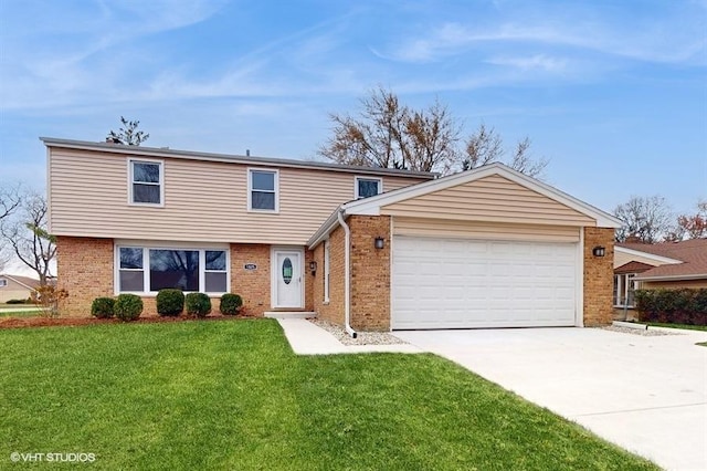 view of front of home with a front lawn and a garage