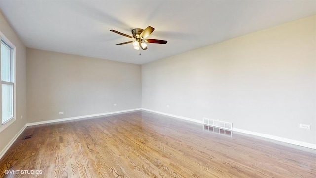 unfurnished room featuring light hardwood / wood-style flooring and ceiling fan