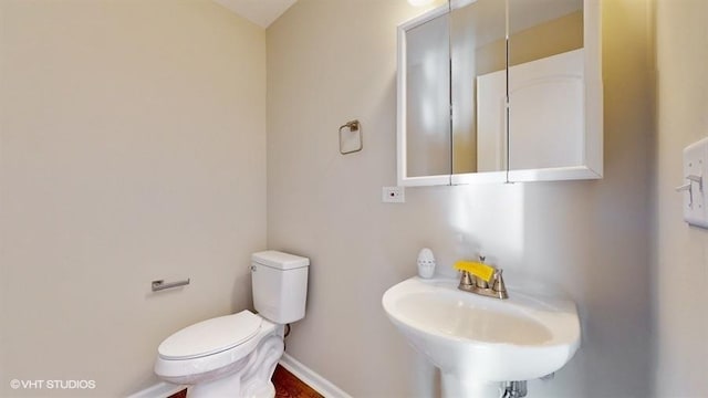 bathroom with toilet and sink