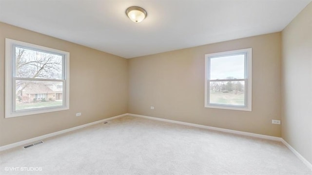 unfurnished room with carpet floors