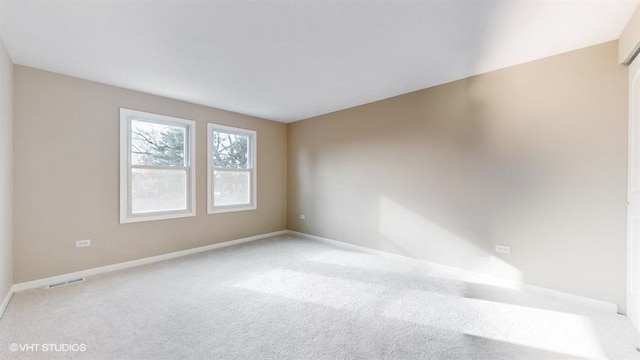 unfurnished room featuring carpet flooring