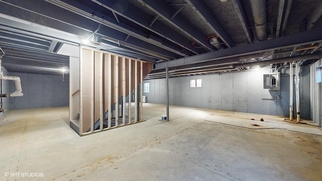 basement featuring electric panel