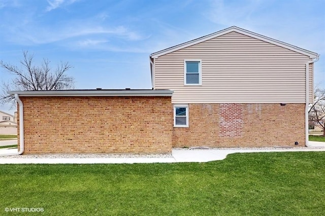 view of home's exterior with a lawn