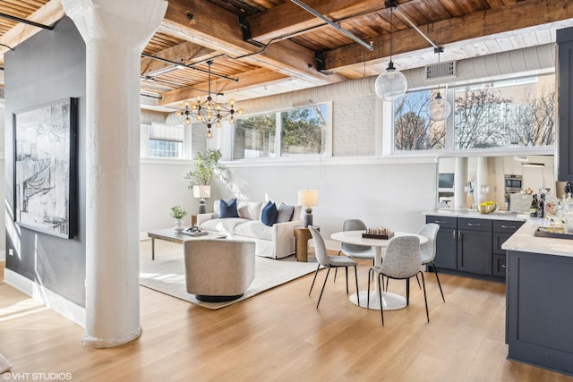 interior space featuring light wood-style flooring, visible vents, wood ceiling, beamed ceiling, and an inviting chandelier