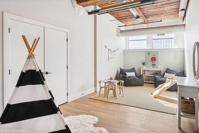 game room featuring light wood-type flooring