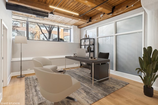 office space featuring wood ceiling, baseboards, wood finished floors, and beamed ceiling