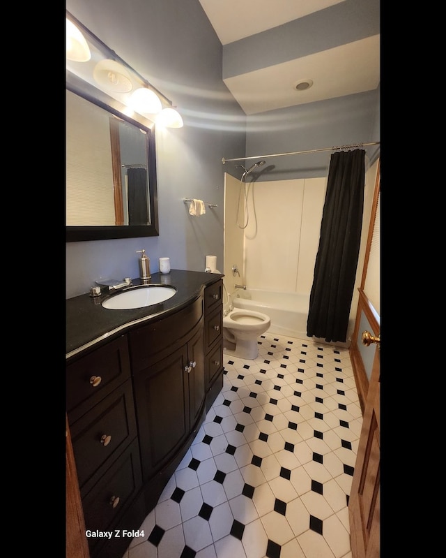 full bathroom featuring vanity, toilet, and shower / bath combo with shower curtain