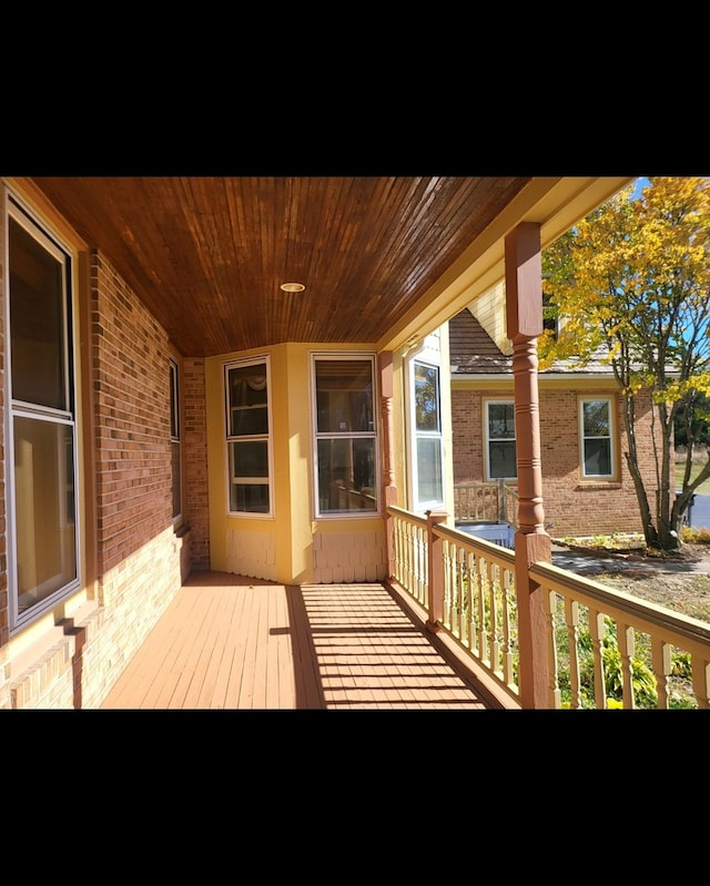 wooden terrace featuring a porch