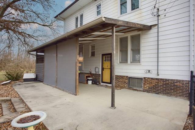 property entrance with a patio