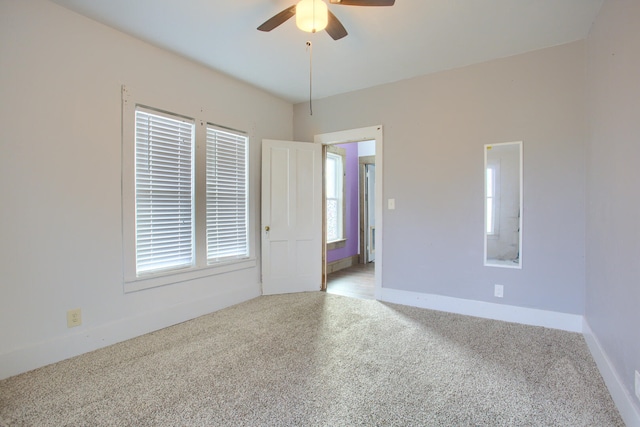 carpeted empty room with ceiling fan