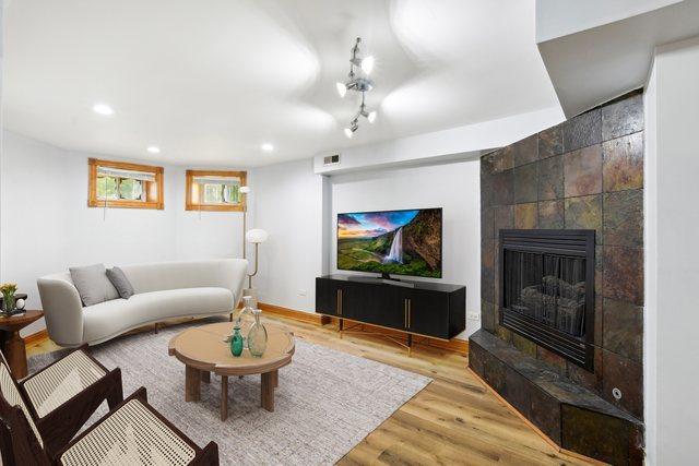 living room featuring a fireplace and hardwood / wood-style floors