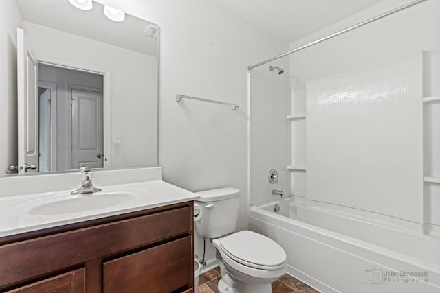 full bathroom with vanity, tub / shower combination, and toilet