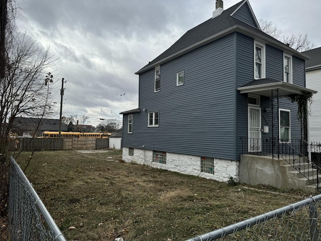 view of property exterior with a yard