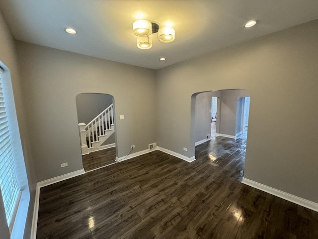 empty room featuring dark wood-type flooring