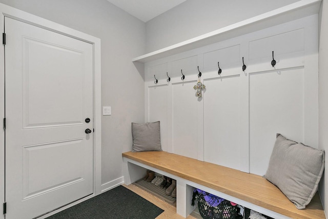 mudroom with light colored carpet