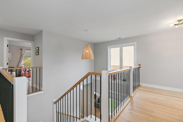 hallway with light wood-type flooring