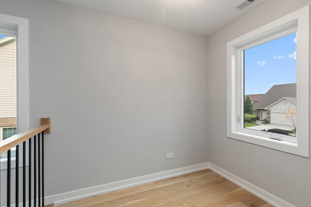 spare room with light wood-type flooring