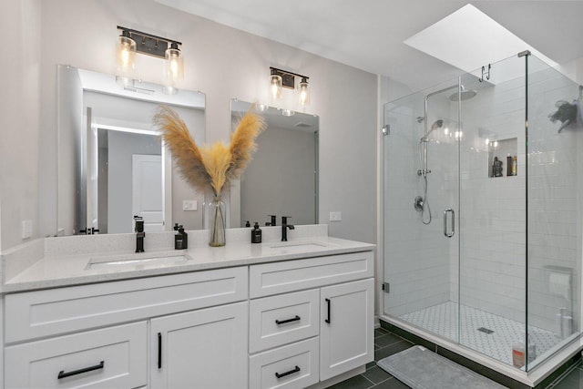 bathroom with vanity, tile patterned floors, and walk in shower