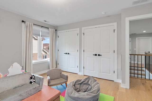 living area with light hardwood / wood-style flooring