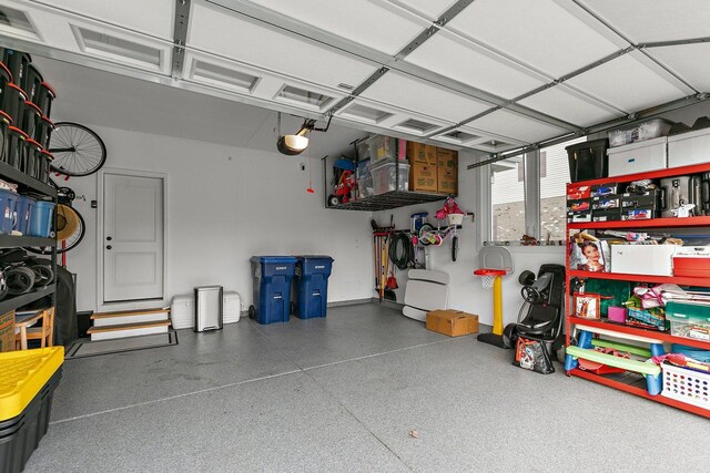 garage featuring a garage door opener