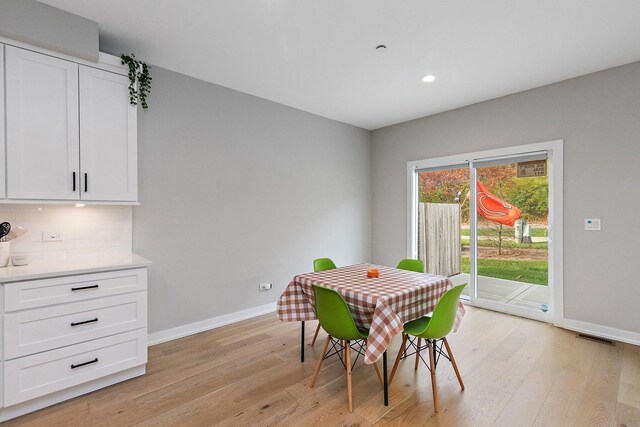 dining area with light hardwood / wood-style flooring