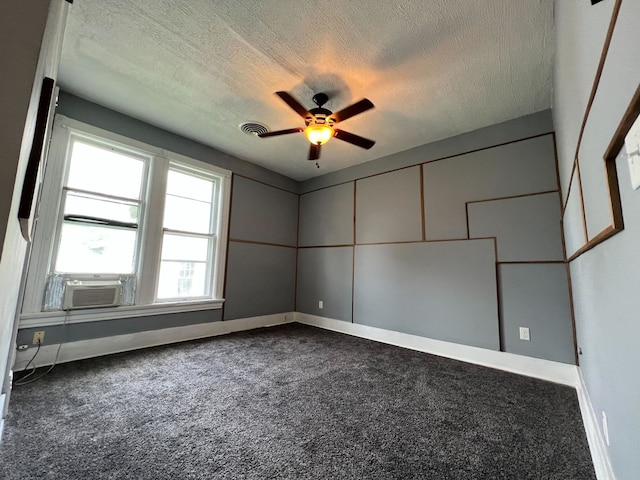 empty room featuring carpet, a textured ceiling, and cooling unit