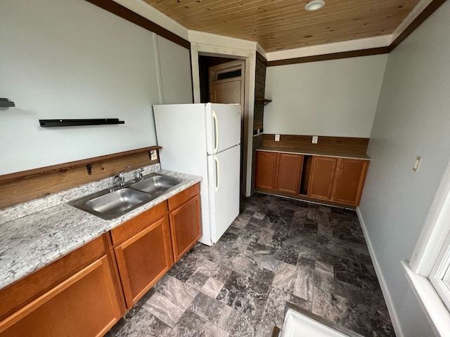 kitchen with wooden ceiling, white refrigerator, crown molding, sink, and light stone counters