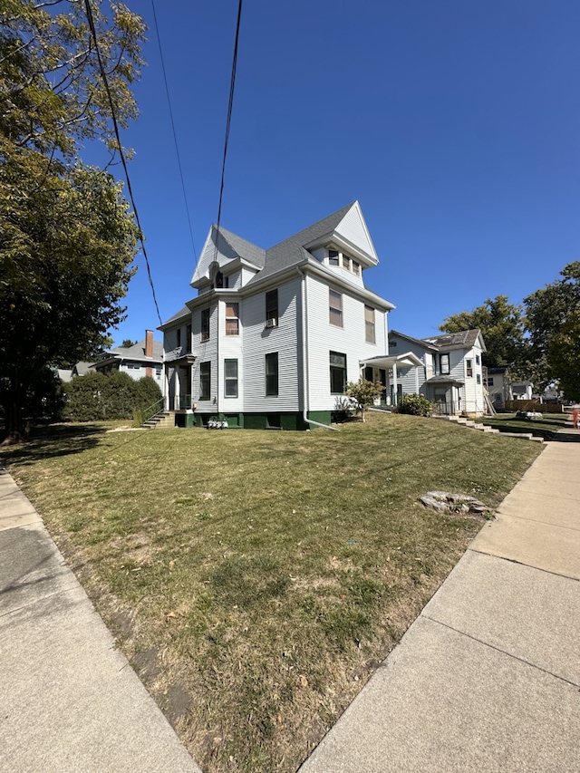 view of home's exterior featuring a yard