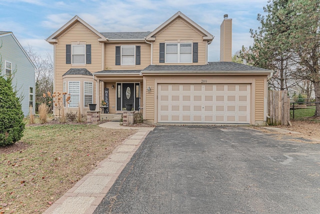 view of front of property featuring a garage