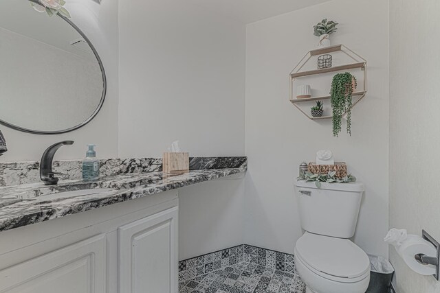 bathroom with vanity and toilet