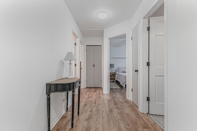 hall with light hardwood / wood-style flooring