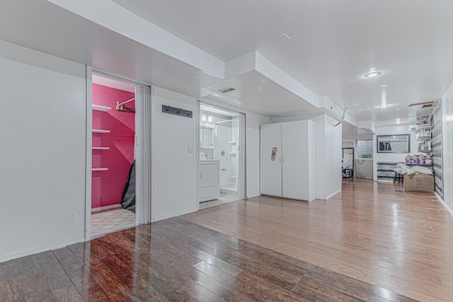 interior space with washer / dryer and hardwood / wood-style flooring