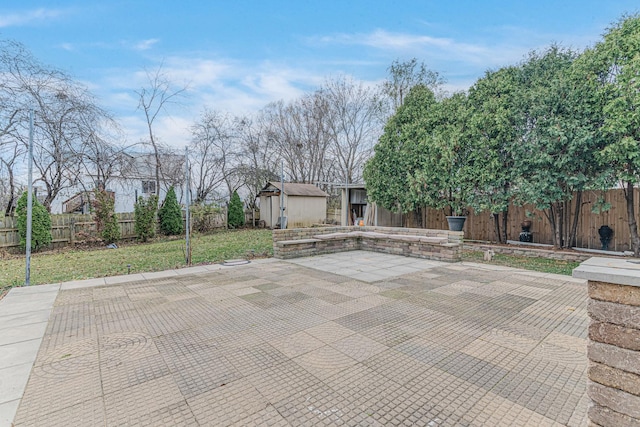 view of patio with a storage shed