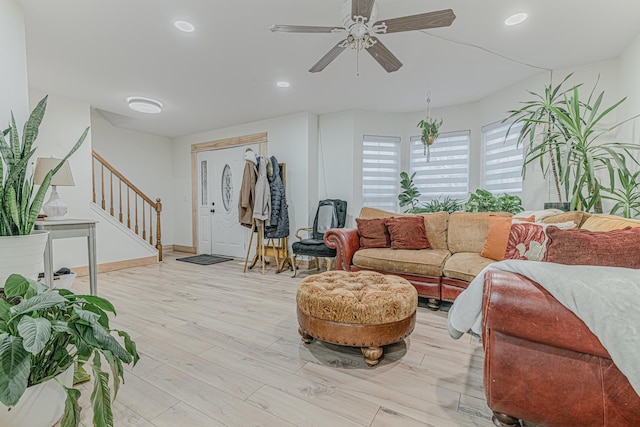 living room with ceiling fan and light wood-type flooring