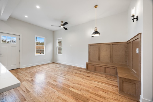 foyer with ceiling fan and light wood-type flooring