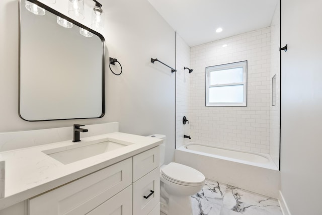 full bathroom with vanity, toilet, and tiled shower / bath