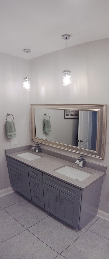 bathroom featuring tile patterned flooring and vanity