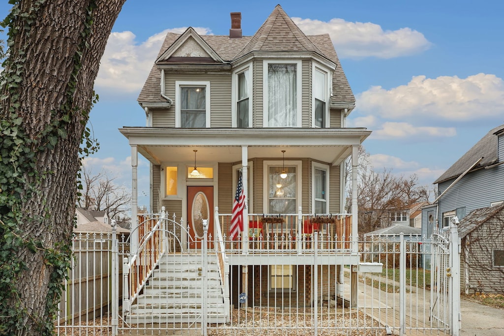 victorian-style house featuring covered porch