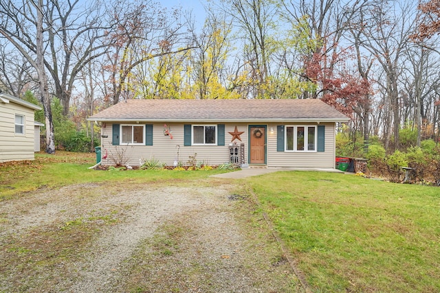 ranch-style house featuring a front lawn