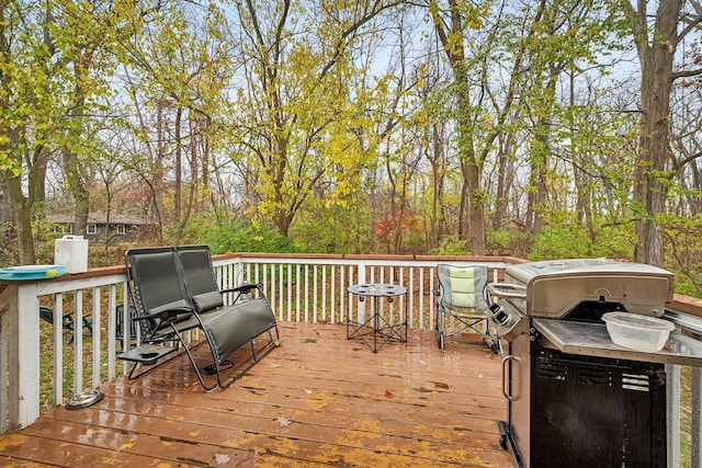 wooden deck featuring grilling area