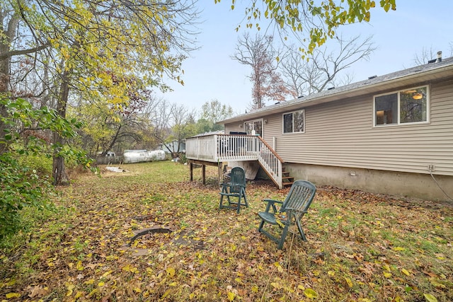 back of house featuring a wooden deck