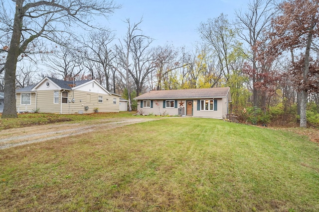 single story home featuring a front yard