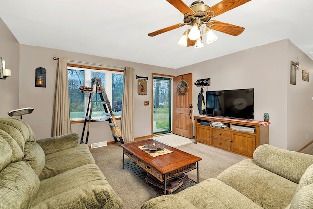 carpeted living room featuring ceiling fan