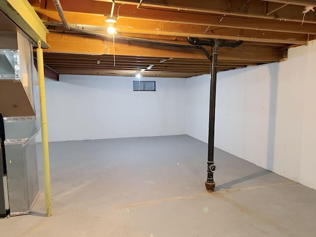 basement featuring heating unit