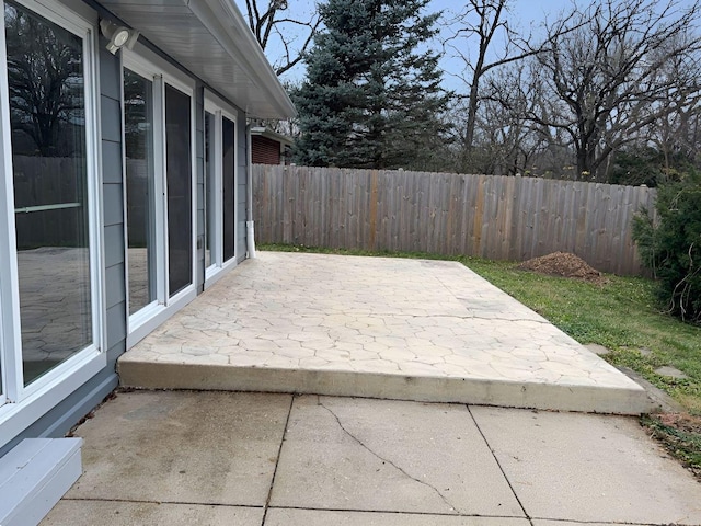 wooden deck with a patio