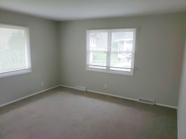 view of carpeted spare room