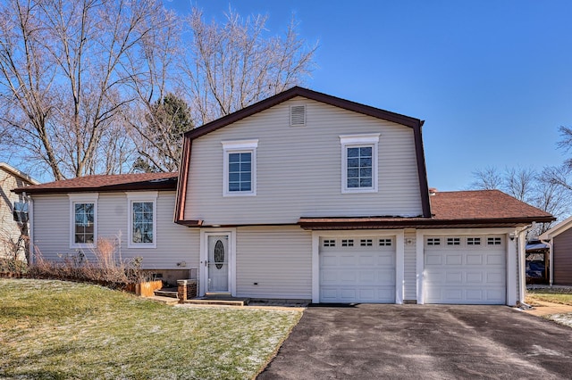 split level home with a front lawn