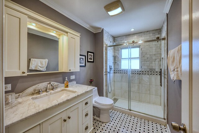 bathroom with vanity, toilet, walk in shower, and crown molding