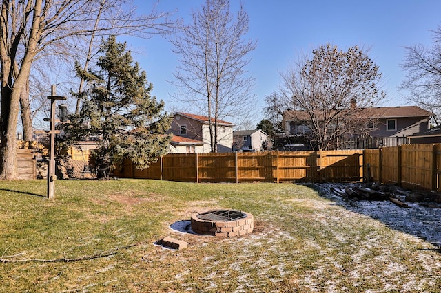 view of yard with a fire pit